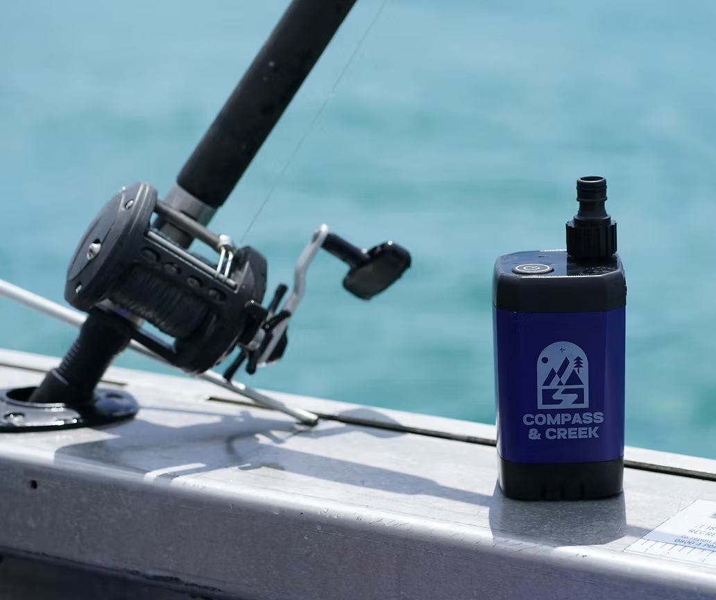 The SaltRinse pump held above the water